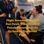 Flight attendant speaking with a frustrated airline passenger during a Southwest flight, illustrating an in-flight customer service dispute.